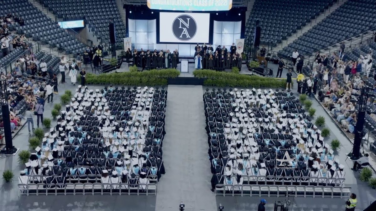 An Artistic Choice: North Atlanta administrators carefully plan out an exciting surprise for graduation guests, with the use of students caps. 