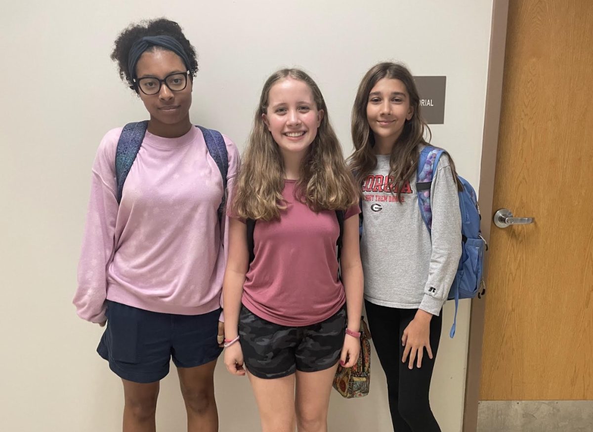 Freshman Hollis Parker-Cruz, Maggie Mason, and Margaret Greer enjoying their stress-free time in between classes.
