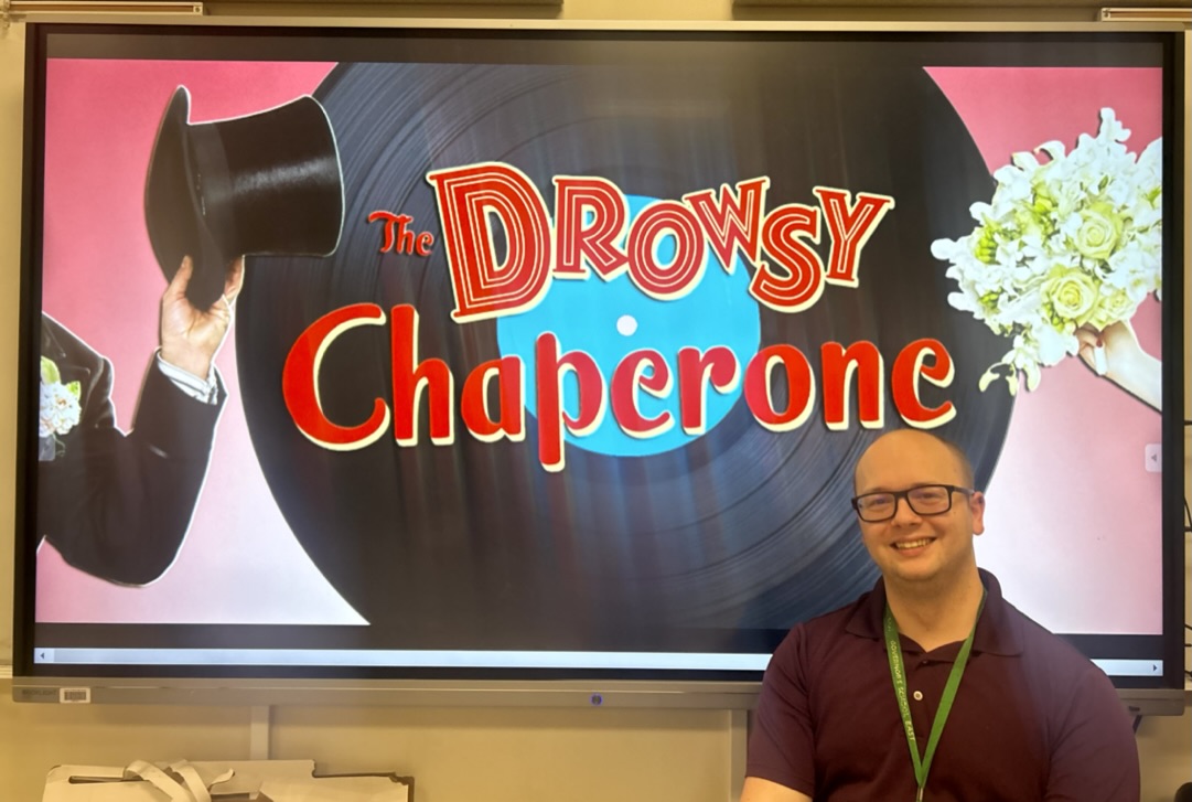 Nathan Snyder, one of the musical heads, smiles in excitement over the 2025 musical theme, The Drowsy Chaperone.