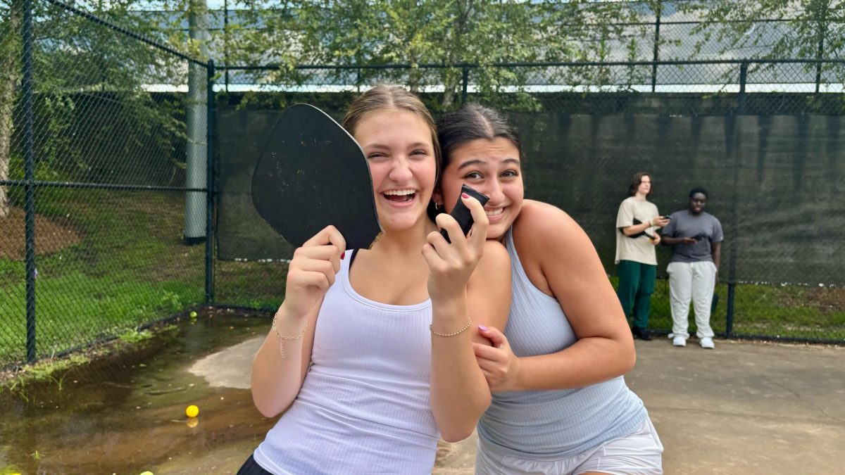 Pickleball club fun caught in action with sophomore members Mackenzie Hart and Melissa Roohi.