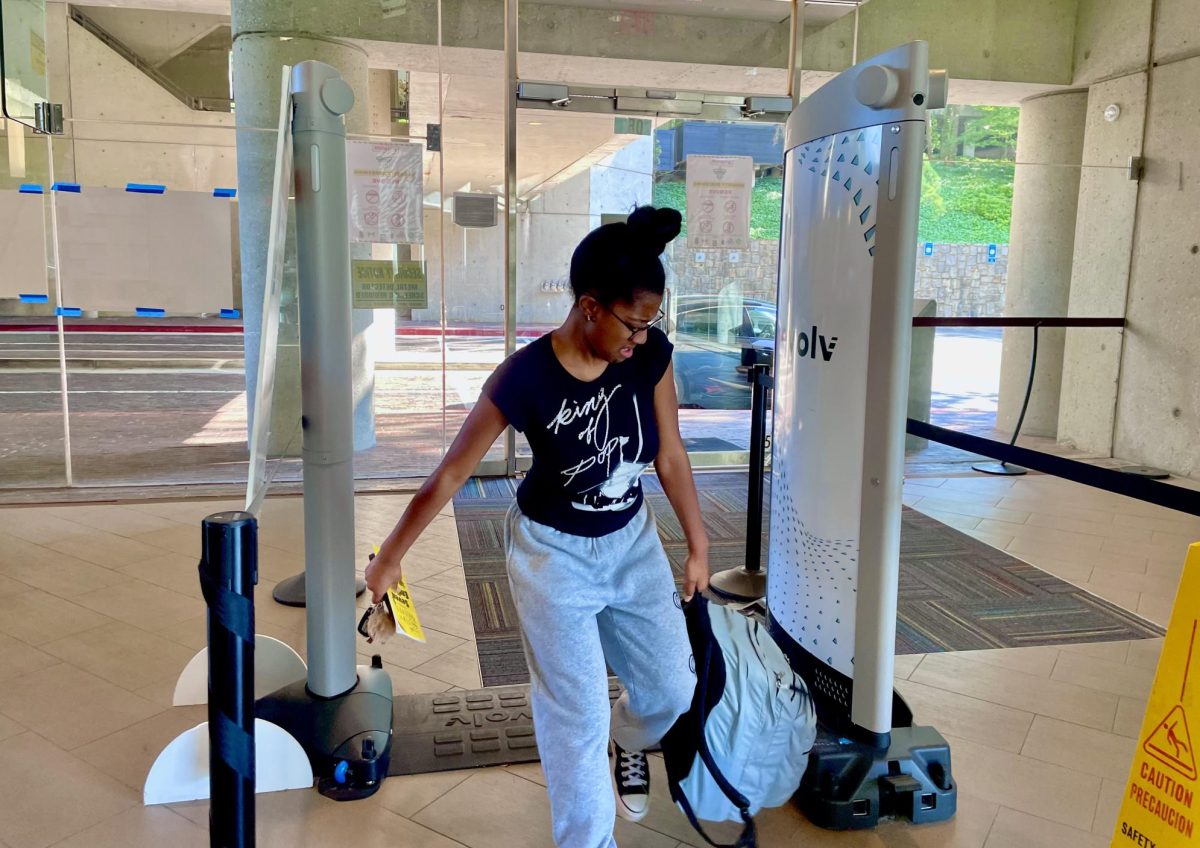 Gabrielle Monplaisir, a senior at North Atlanta, reacting through the struggle that bag check makes students undergo most mornings.