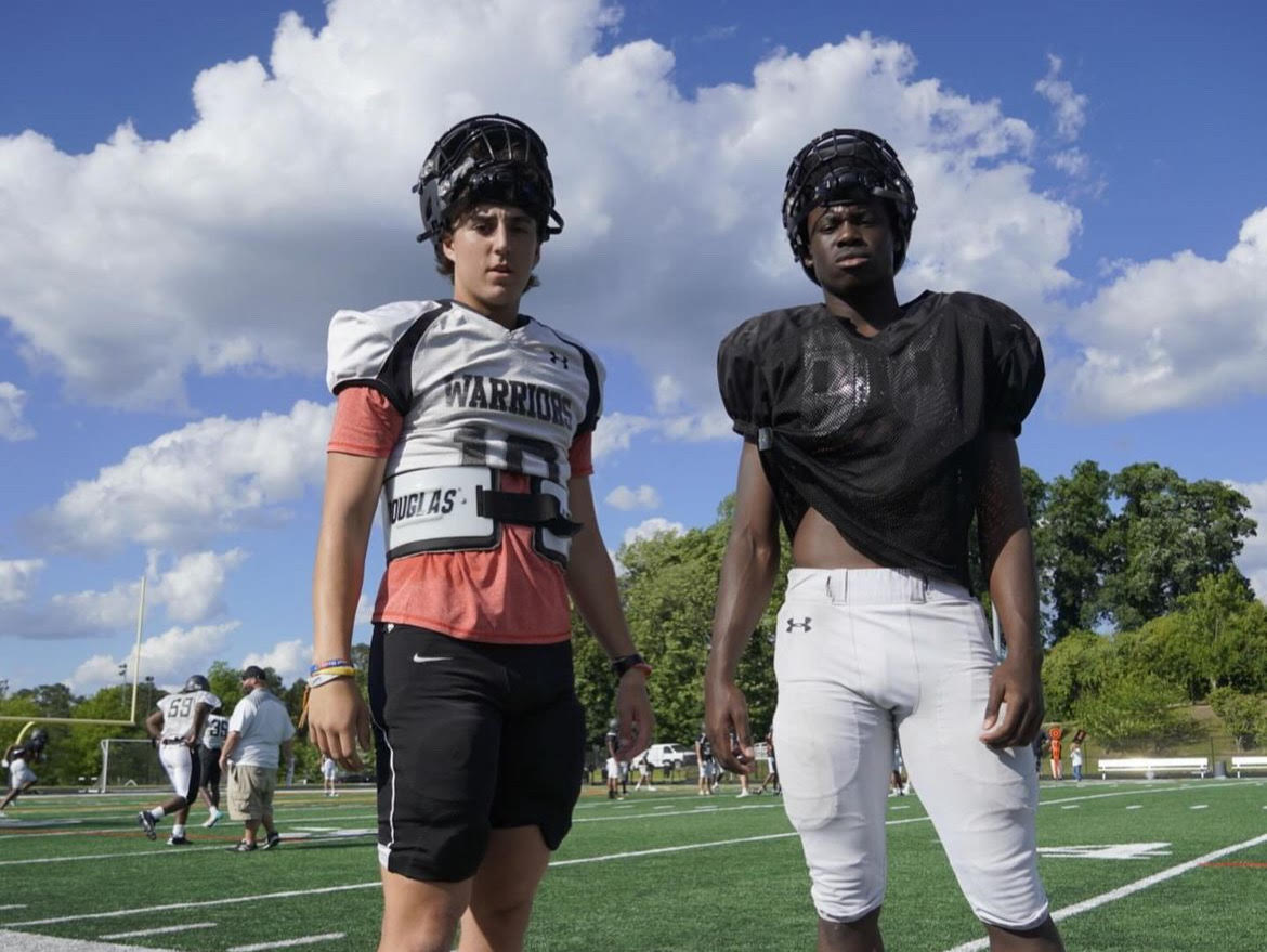 Instead of sleeping in, Seniors Ian Reynolds (left) and Chase Linton (right) get ready for a long practice on the gridiron.
