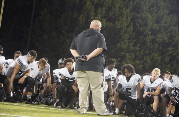 Addressing the Troops: Coach Aull talks to the team after a huge win
