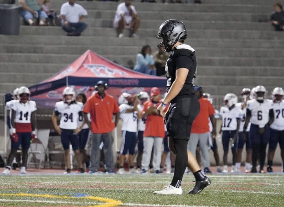 Lucas England steps onto the field ready to send the Wheeler Wildcats home with a loss.
