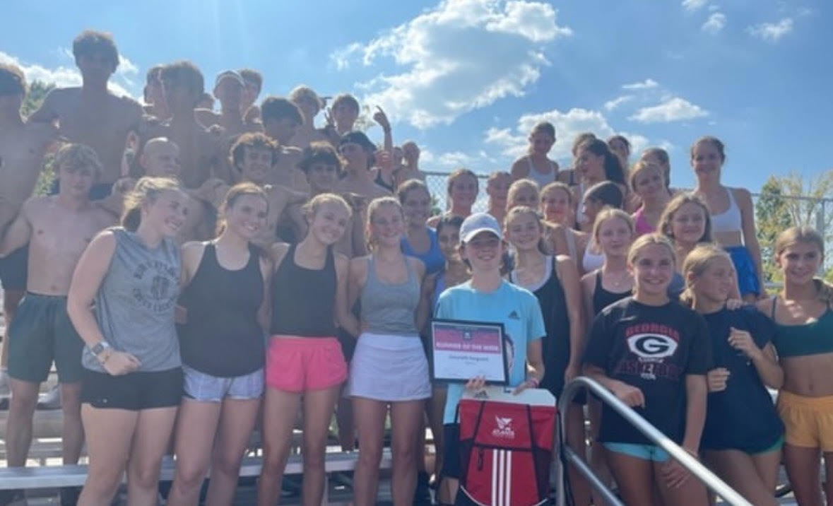 Warriors Charge: North Atlanta XC Poses for a team photo after their first meet
