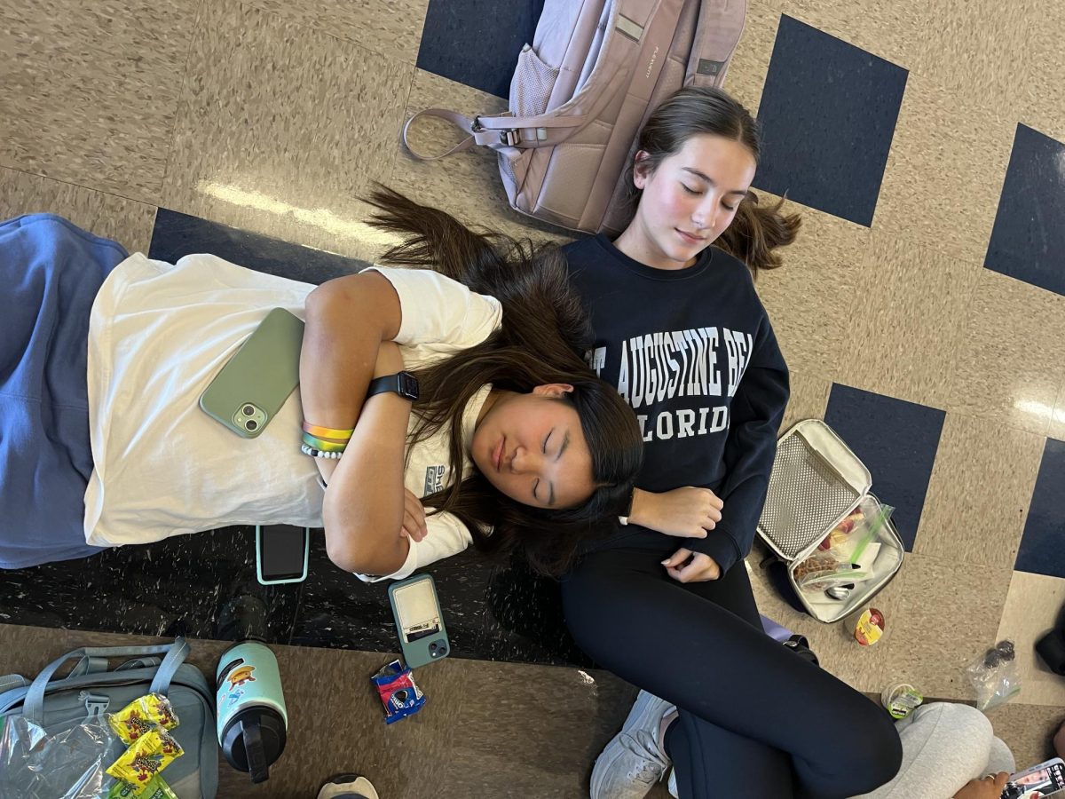 Juniors Michelle Baek and Emily Shull trying to catch sleep whenever they can, even during lunch.