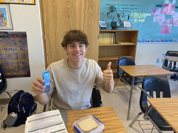 Junior Ryan Edwards eating a protein bar to bulk up for the dubs football team.