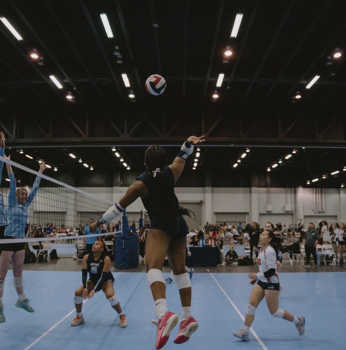 Laila Amos leaps in the air for a voracious kill