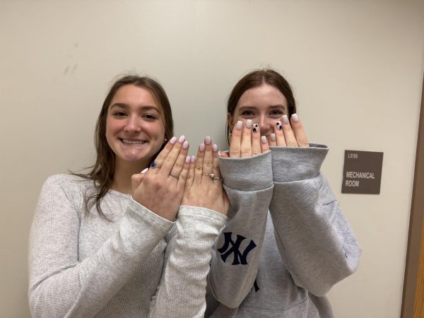 Nail No Go? Juniors Mary Ellen Little and Audrey Khayat pose with their freshly manicured nails, but do they know the risks?
