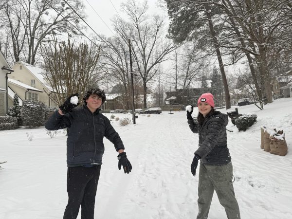 Neighbors, Franklin Pickens (10) and Riley Higgins (12), enjoying their day off with a snowball fight.