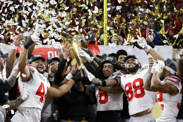 The Ohio State Buckeyes celebrate a 34-23 victory over the Notre Dame Fighting Irish in the 2025 college football National Championship
