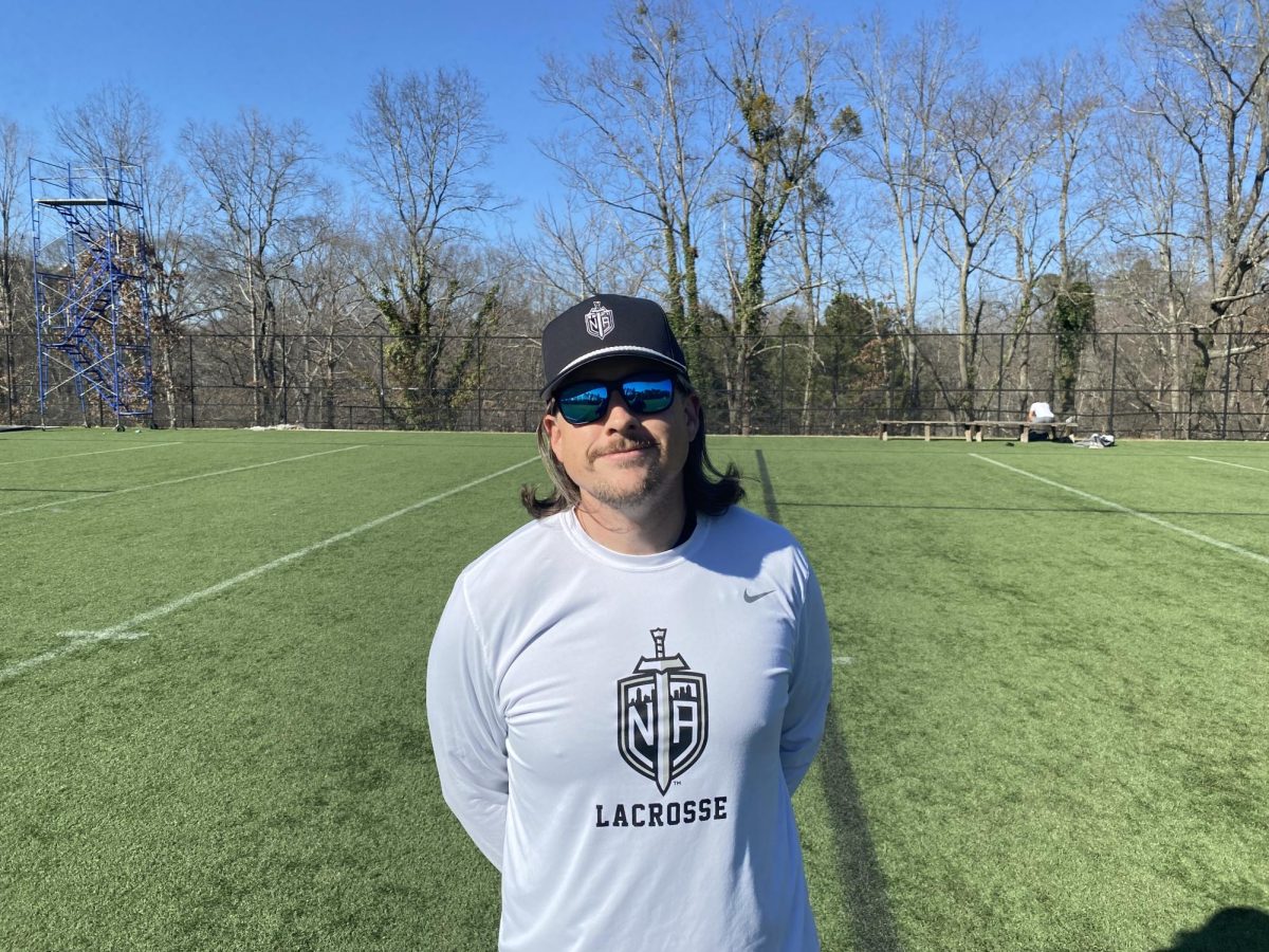 Coach Haskins getting ready for lacrosse practice on the North Atlanta practice field.