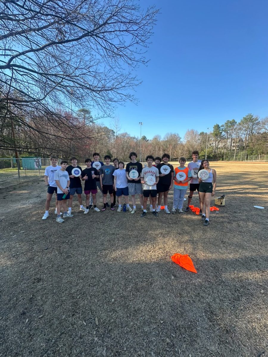 The Ultimate Frisbee team poses after a productive practice after school.