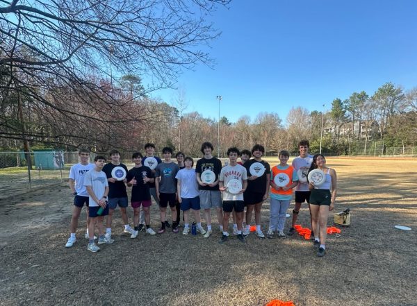 The Ultimate Frisbee team poses after a productive practice after school.