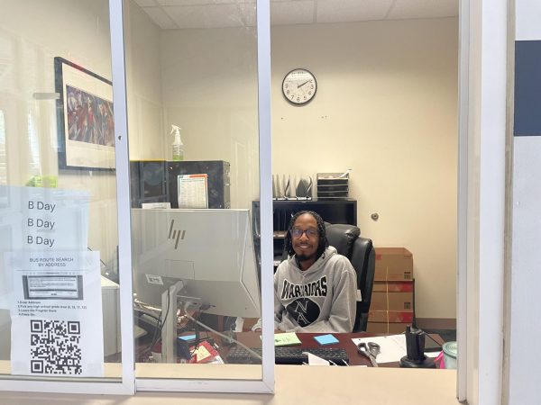 Afternoon Check: Xavier Smith is busy sending out the early dismissal for athletes.