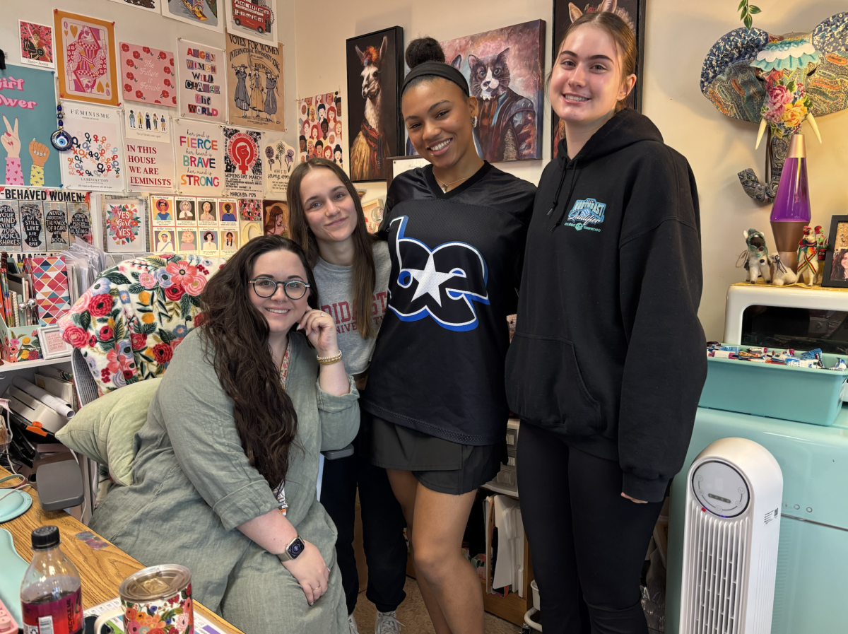 Sophia Gonzalez, Ryan Rodgers-Givens, Katriane Pawlowski (left to right) pose with Ms. Tripp