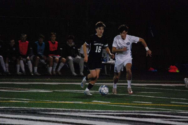 Stepping Up: Junior Grant Benner stands tall as he dribbles illustriously across the the pitch